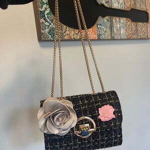 Elegant Black and Gold Tweed Bag with Floral Accents